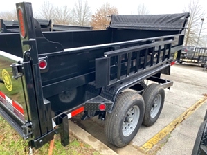 Dump Trailer 12000 GVW Professional Grade Dump Trailer 12000 GVW Professional Grade. 12,000 GVW, dual cylinders, tarp kit included, and dual function tailgate. 